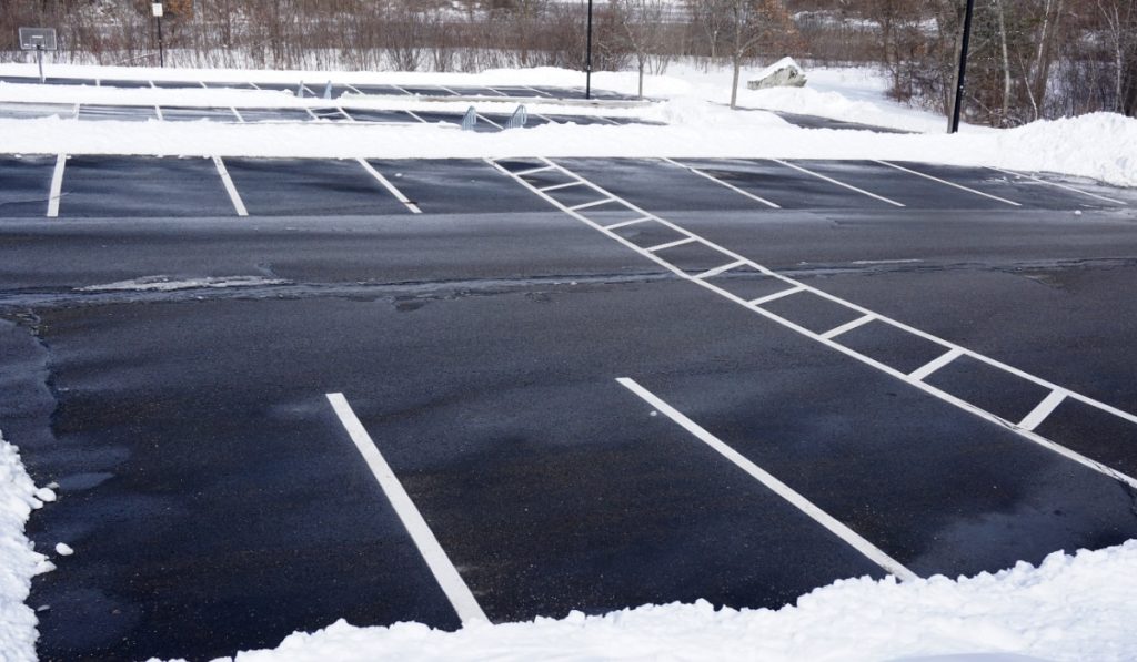 empty parking lot with snow removed